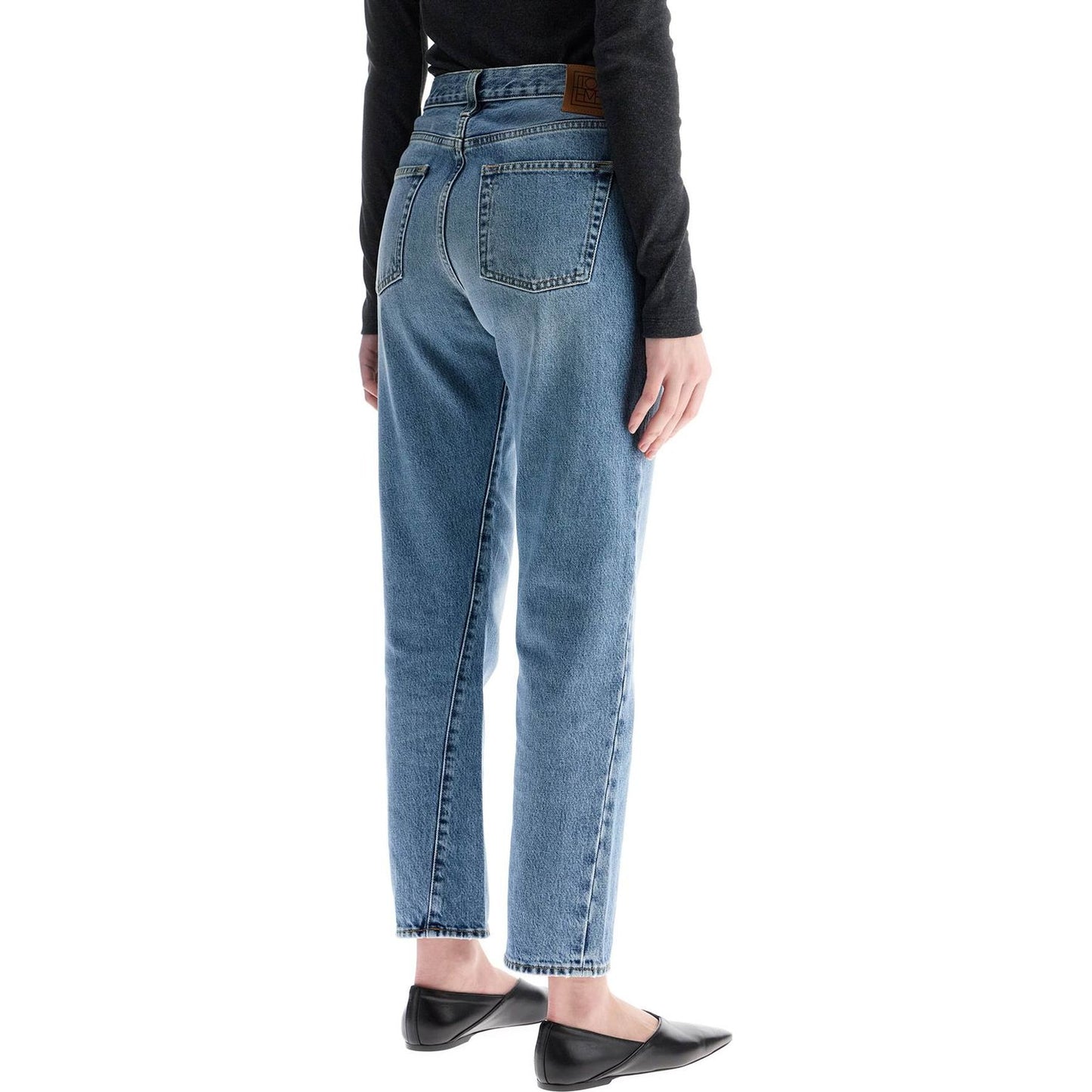 Toteme worn blue organic cotton jeans with twisted seams